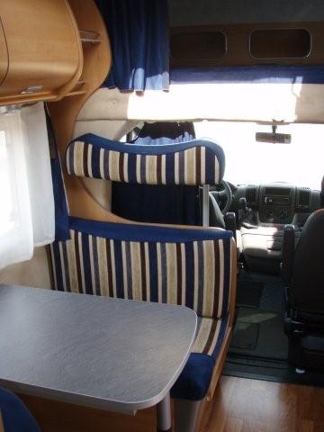 above cab bed folds down, front pass seat swivel
