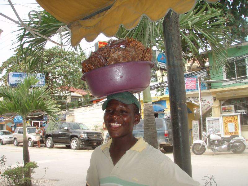 Candy Man
This guy carries this bowl of candy{Sweet coconut ball,and peanut brittle} all day .
