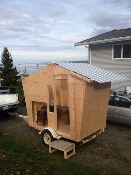 The plan is to finish the outside with cedar shingles. 12 volt lighting and sound system. Outside shower and wood storage box up front. It is a bit more finished than in these pics. Will try to update soon. 
