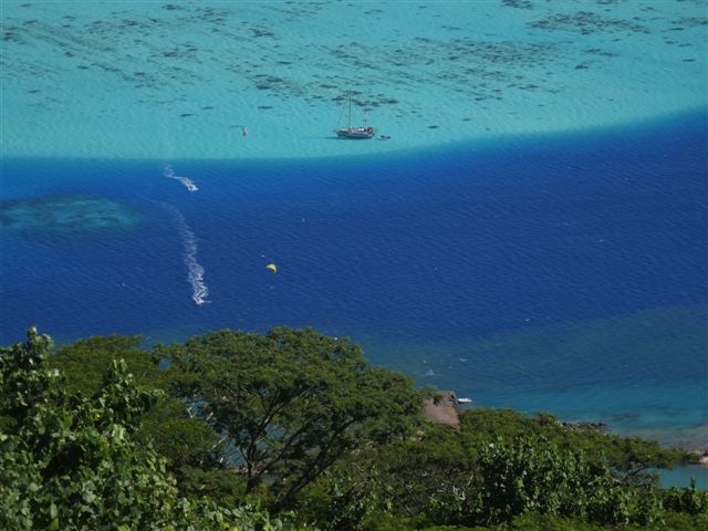 Haapiti anchorage, always solo there, kiting and windsurfing in the lagoon at max Maaramu/sw depression giving usually 20-35knts/3m swell, so you stay in lagoon!